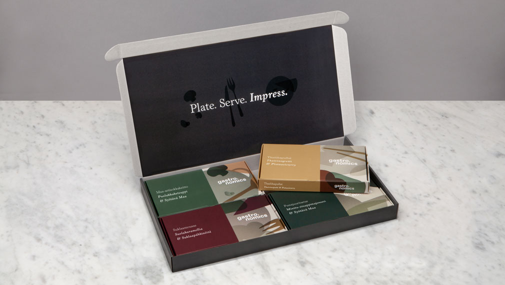 Gastronomics postage box interior with individual recipe boxes on white marble