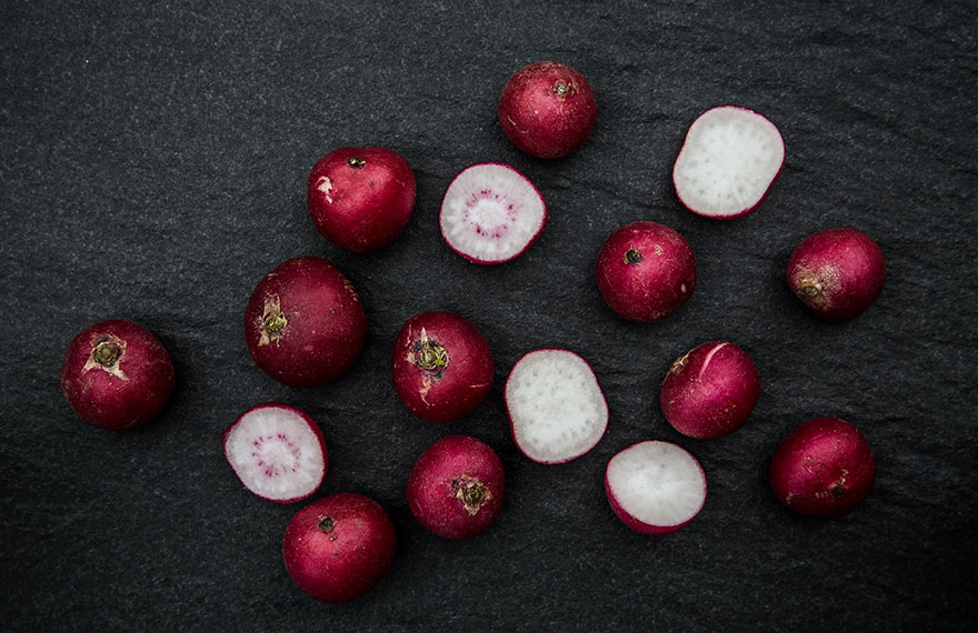 Still life photography of locally sourced radishes on granite