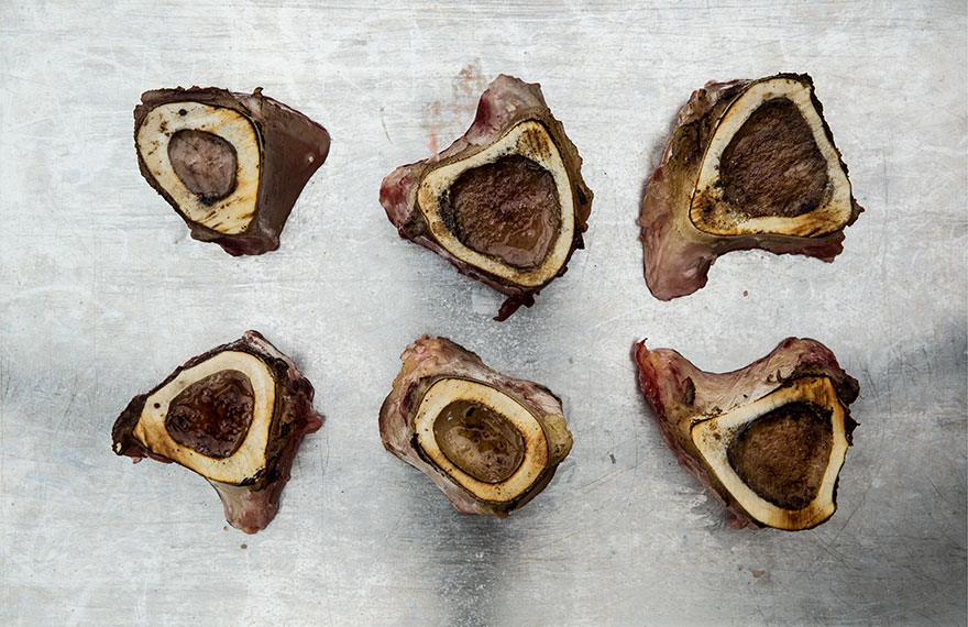 Still-life photography of locally sourced shin of beef marrow on baking tray