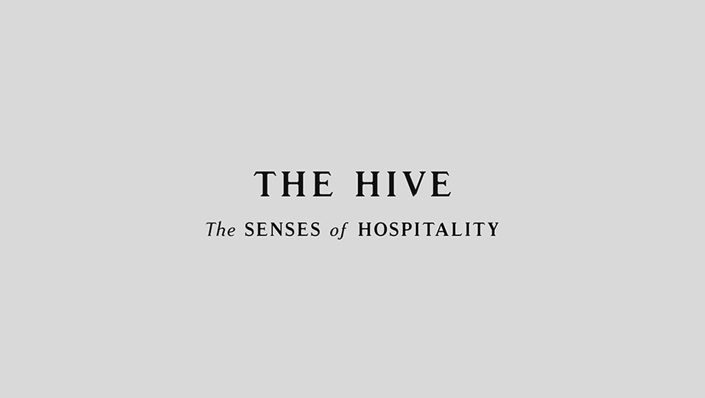 Premium brand logotype typography for hospitality event The Hive